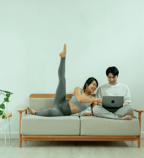 Cozy corner at home with a yoga mat, plant, and soft light.